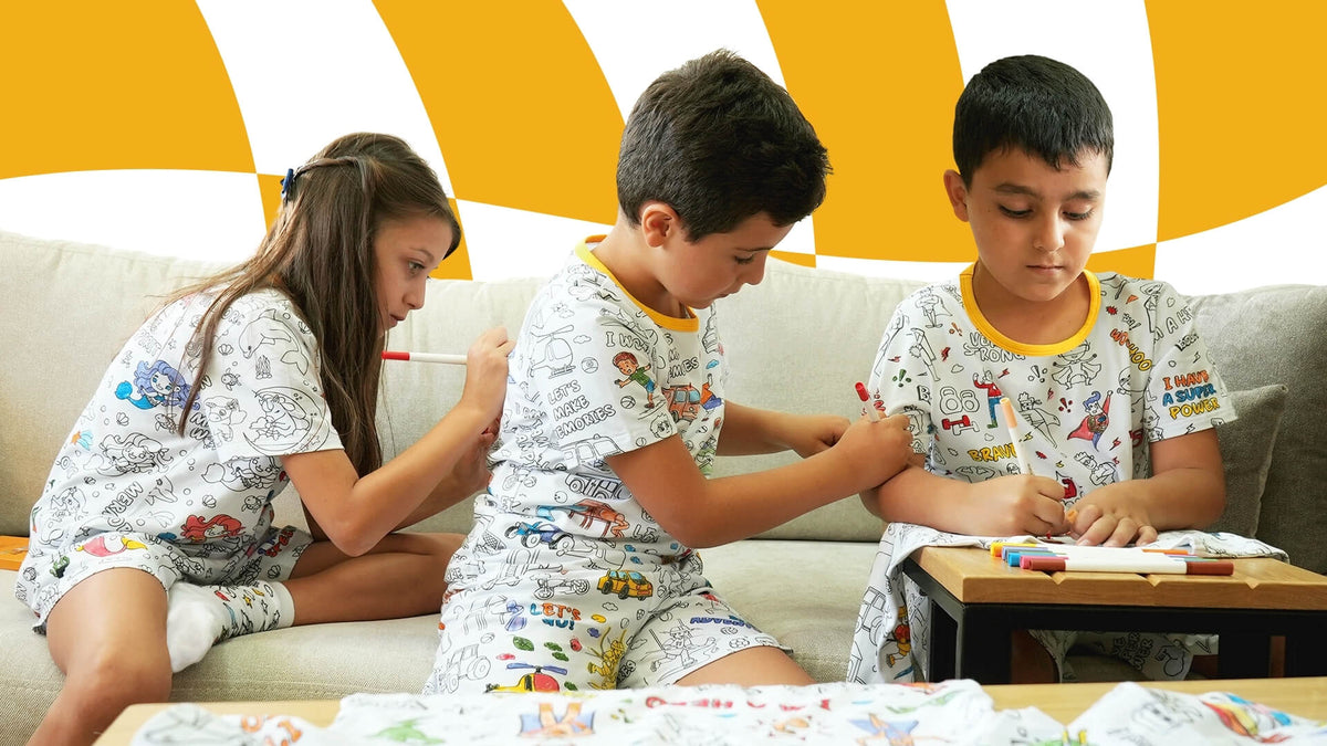 Children enjoying Clooloo coloring pajamas